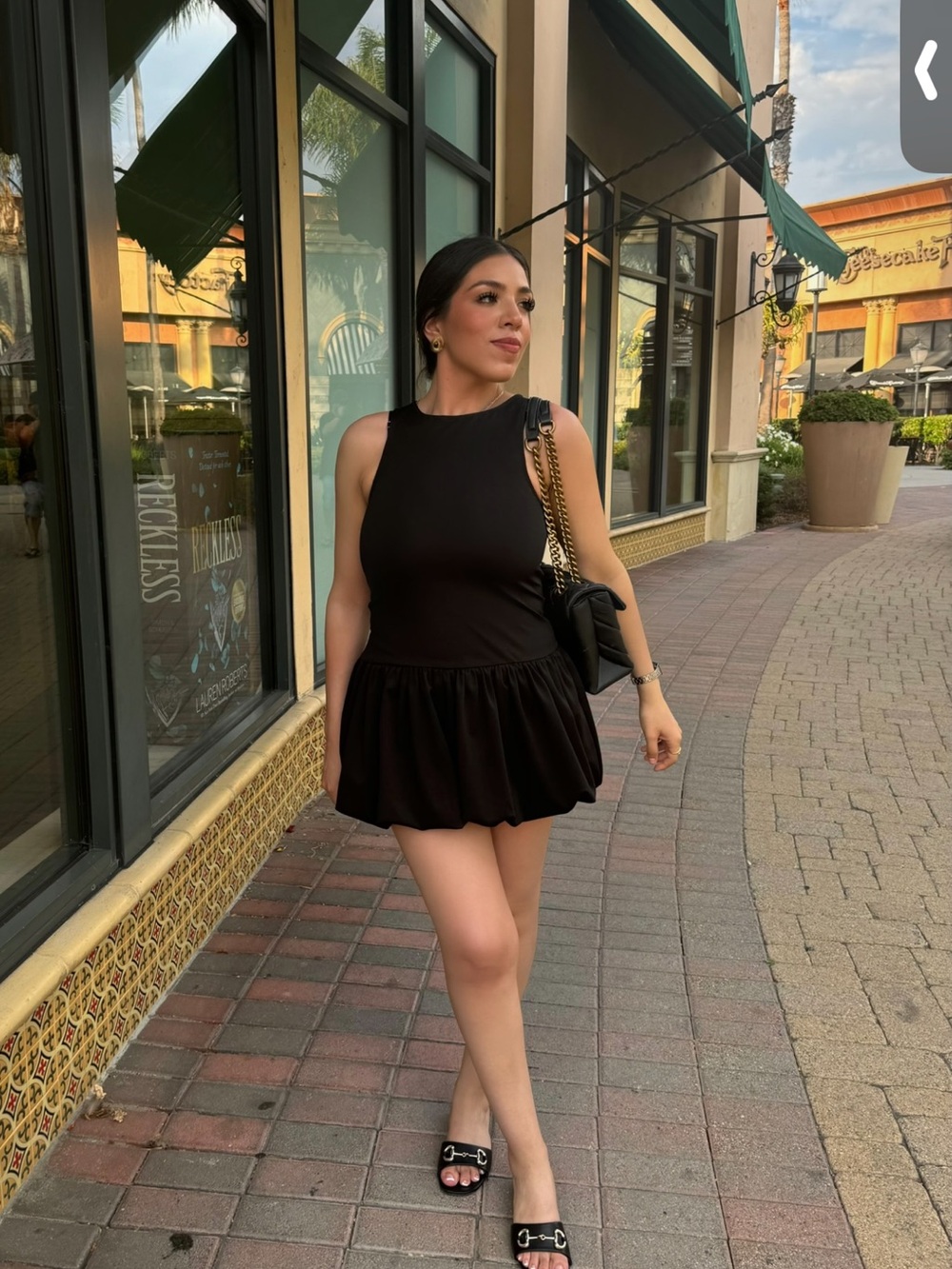 Black Sleeveless Mini Dress with Ruffled Skirt